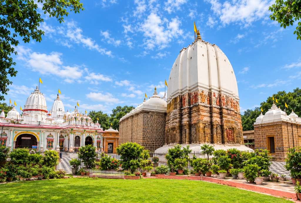 Vibrant Hindu Temple Courtyard Under Blue Skies